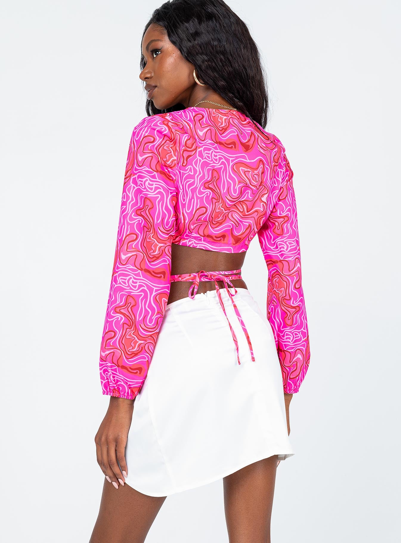 back view of model wearing Princess Polly Nahla Knot Mini Skirt White Mini Skirts 