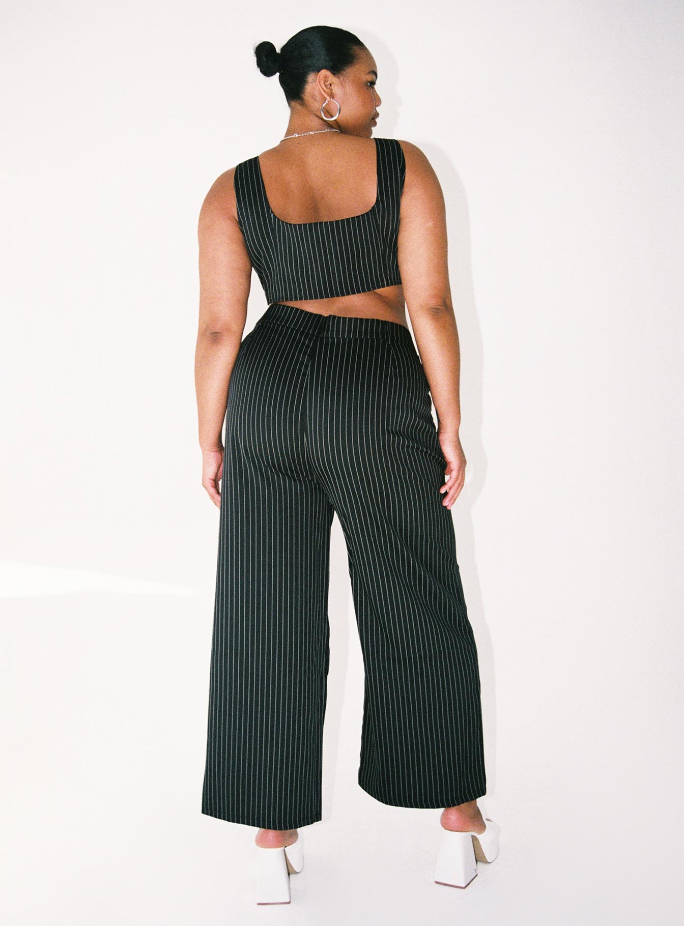 Matching set Pinstripe print   Crop top  Fixed shoulder straps  Invisible zip on side  High waisted pants  Wide leg Zip & button fastening  Belt looped waist  Twin hip pockets 
