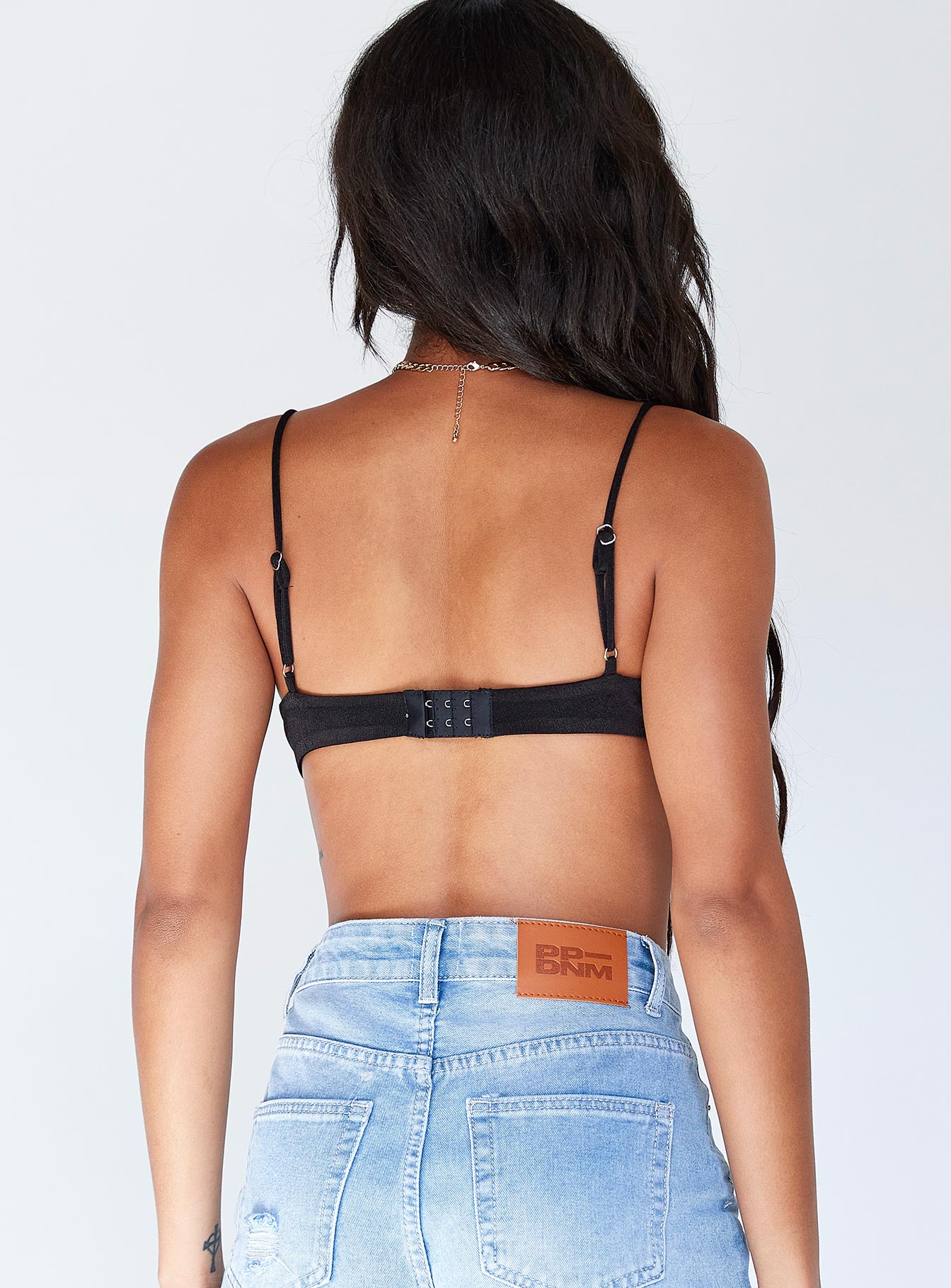 back view of model wearing Princess Polly Adelaide Bodysuit Black Sleeveless Plunger 