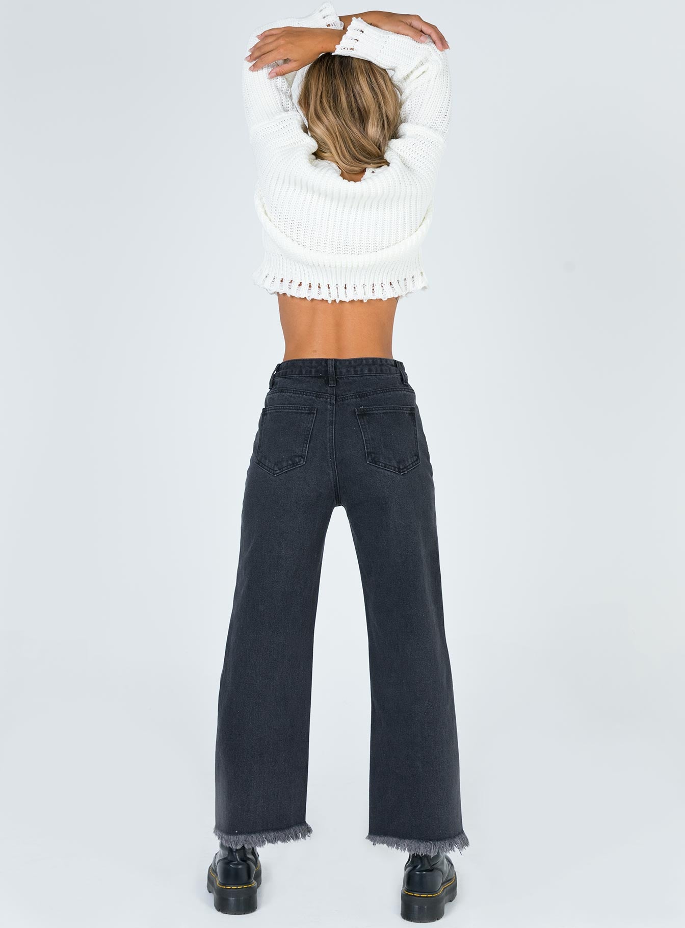 back view of model wearing Princess Polly Cece Hammer Wide Leg Knee Rip Jeans Black Denim High Waisted 