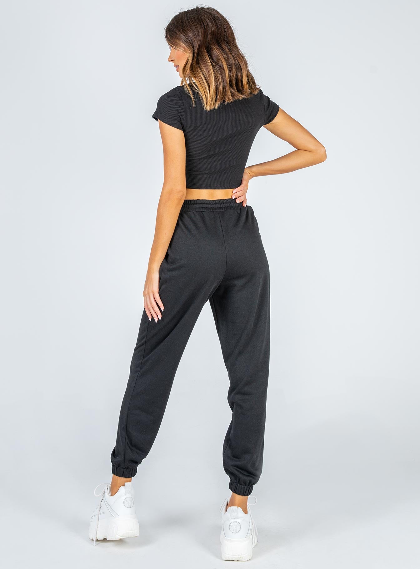 back view of model wearing Princess Polly Nero Sweat Pants Black 