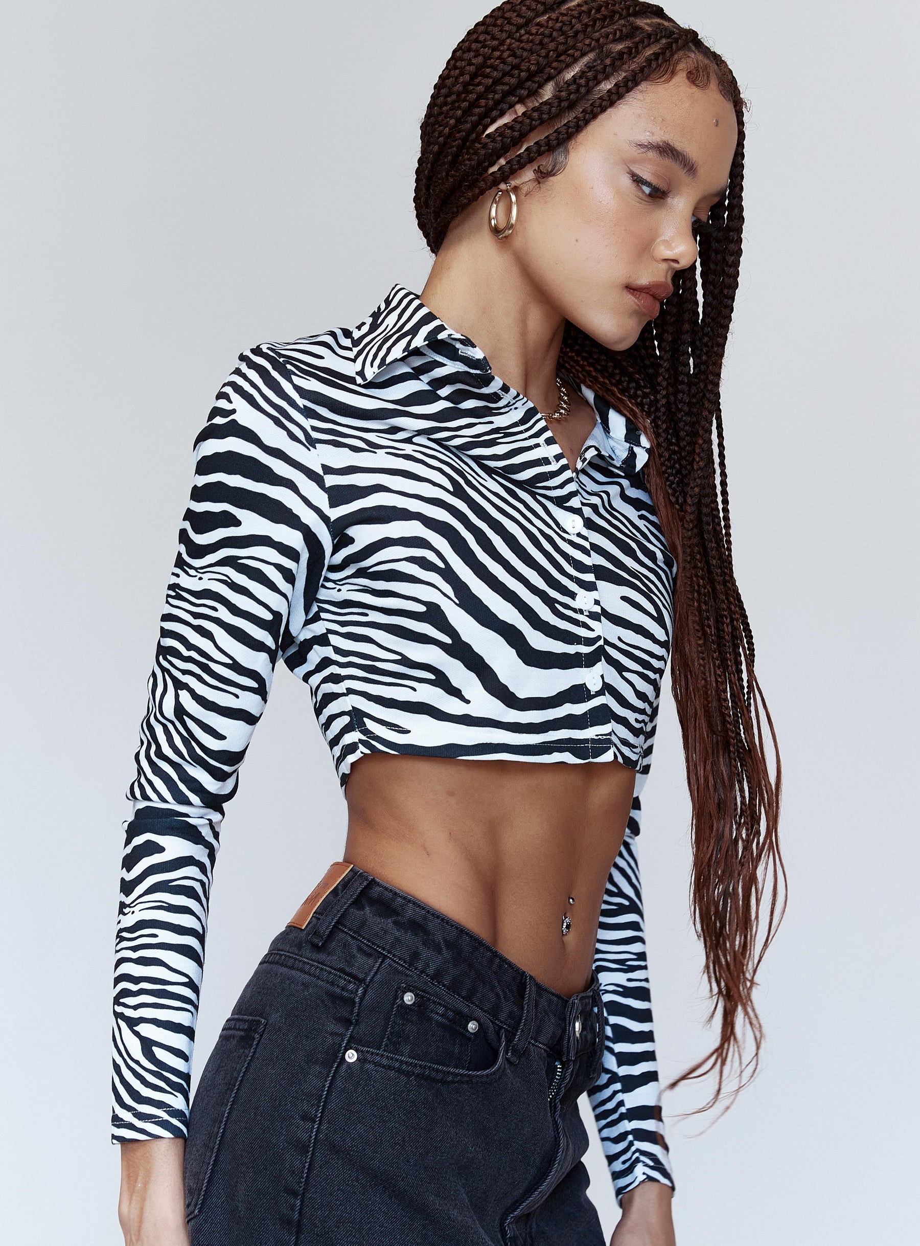 side view of model wearing Princess Polly Jayla Long Sleeve Top Black / White 