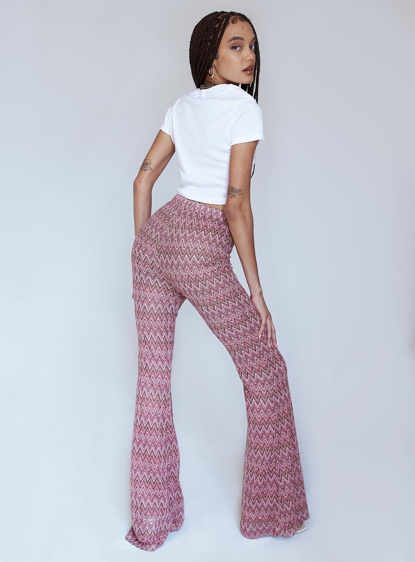 back view of model wearing Princess Polly Karmen Chevron Knit Flare Pants Pink 