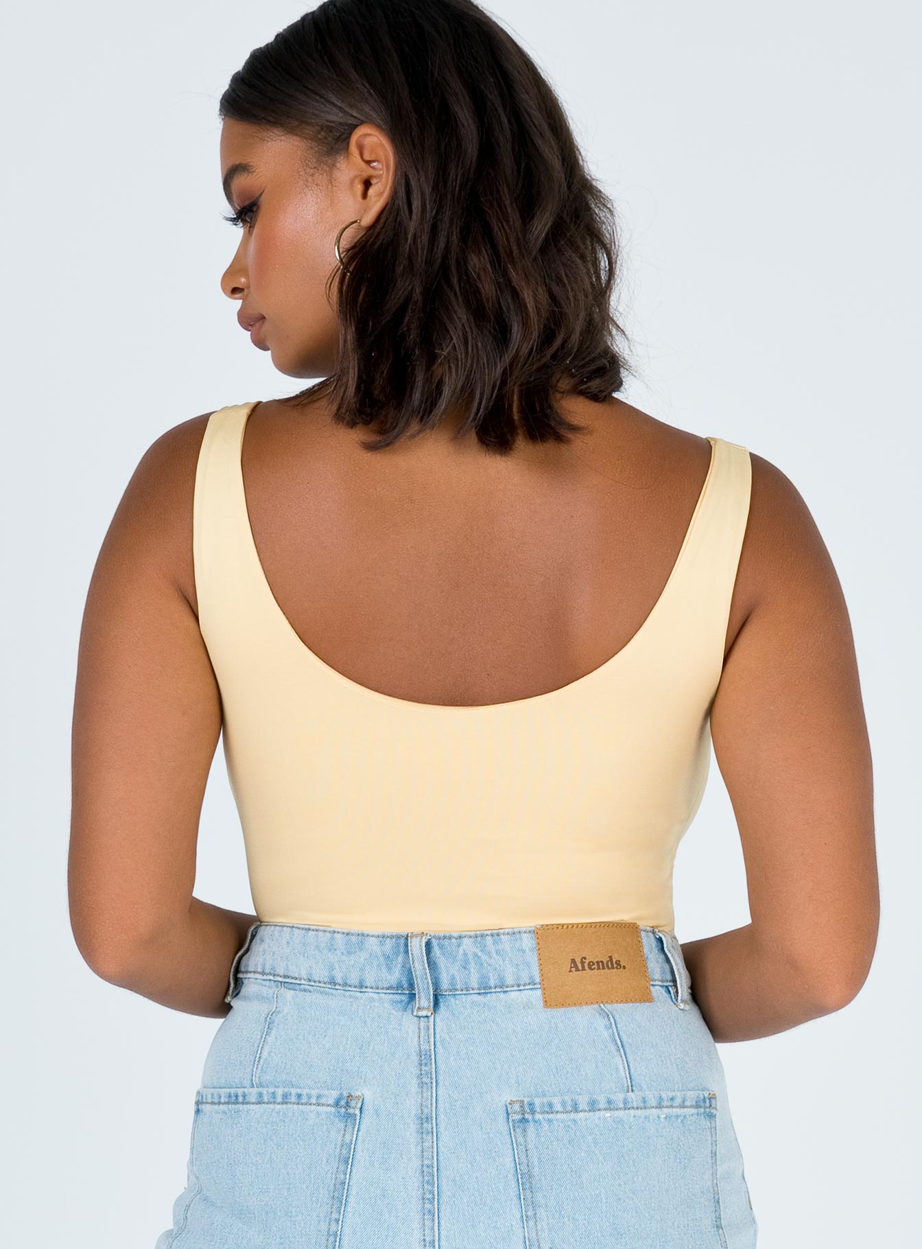 back view of model wearing Princess Polly Tamikah Bodysuit Sleeveless Scoop Neck 