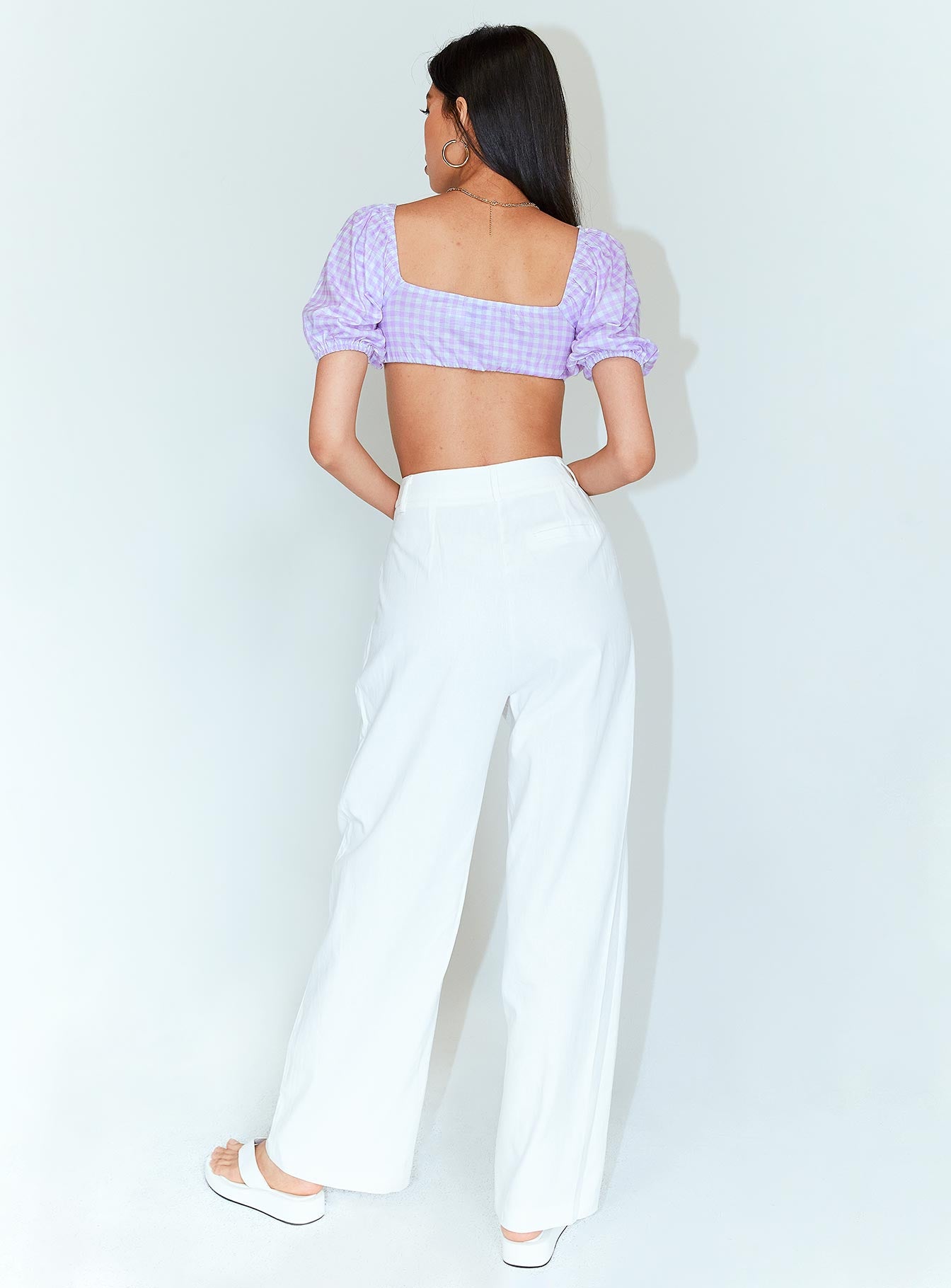 back view of model wearing Princess Polly Ayla Linen Pants White 