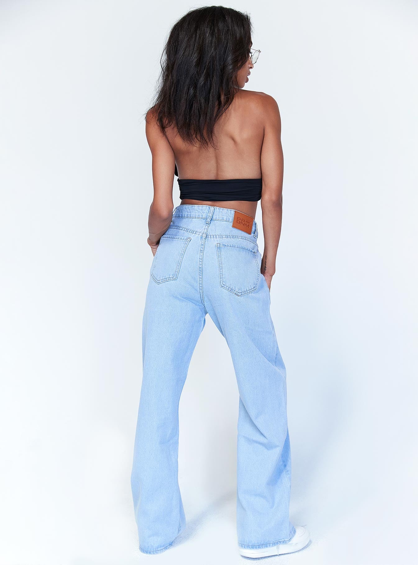 back view of model wearing Princess Polly Chicago Denim Jeans Mid Rise 