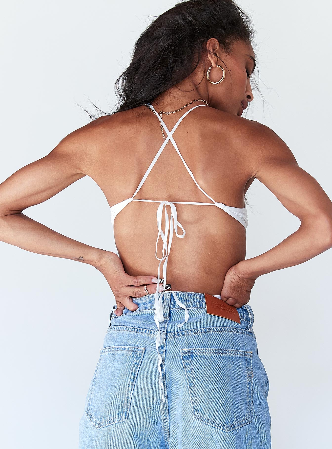 back view of model wearing Princess Polly Henrietta Bodysuit White Sleeveless Plunger 