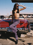 side view of model wearing Princess Polly Motel Eda Trouser Desert Terrain Purple 