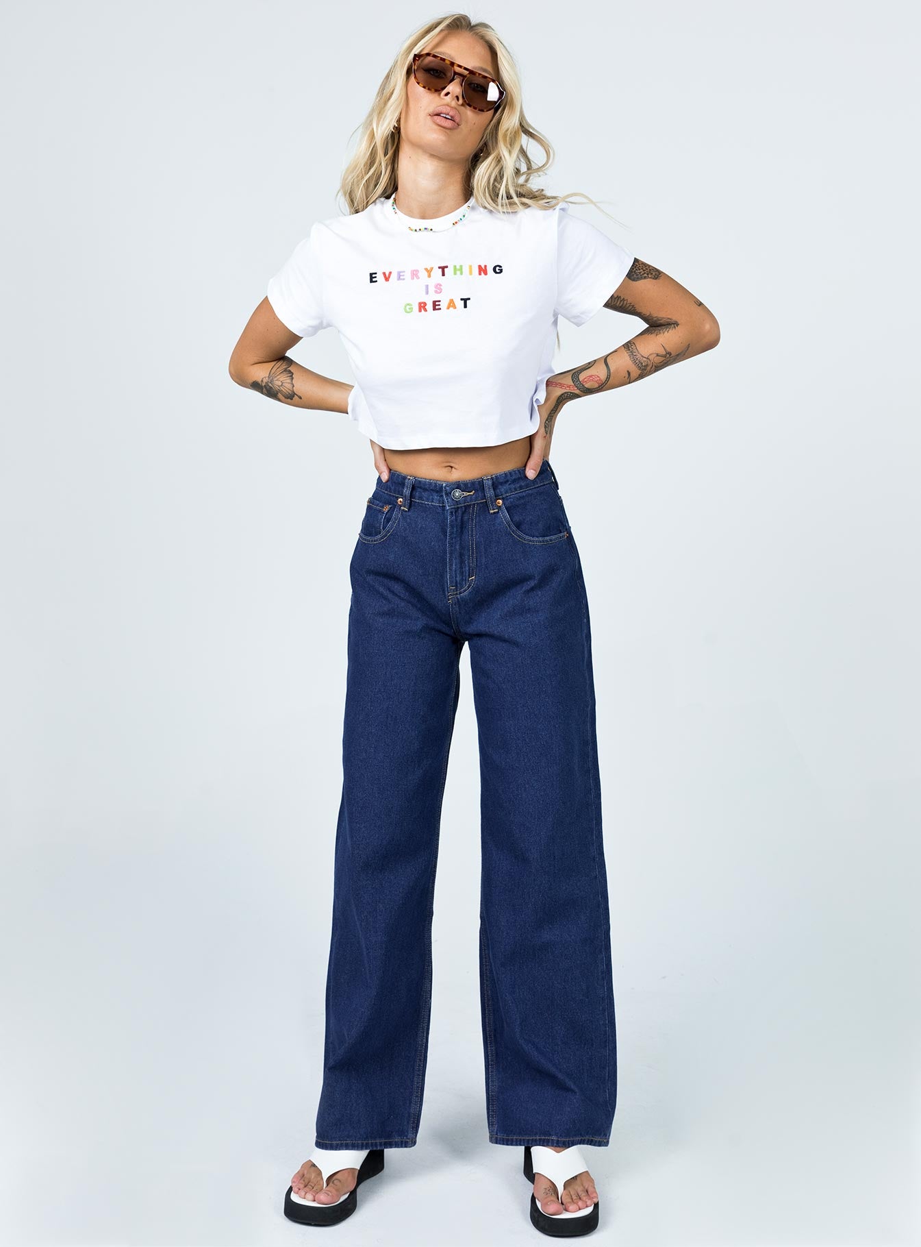 front view of model wearing Princess Polly Motel Extra Wide Jeans Indigo Blue Mid Rise 