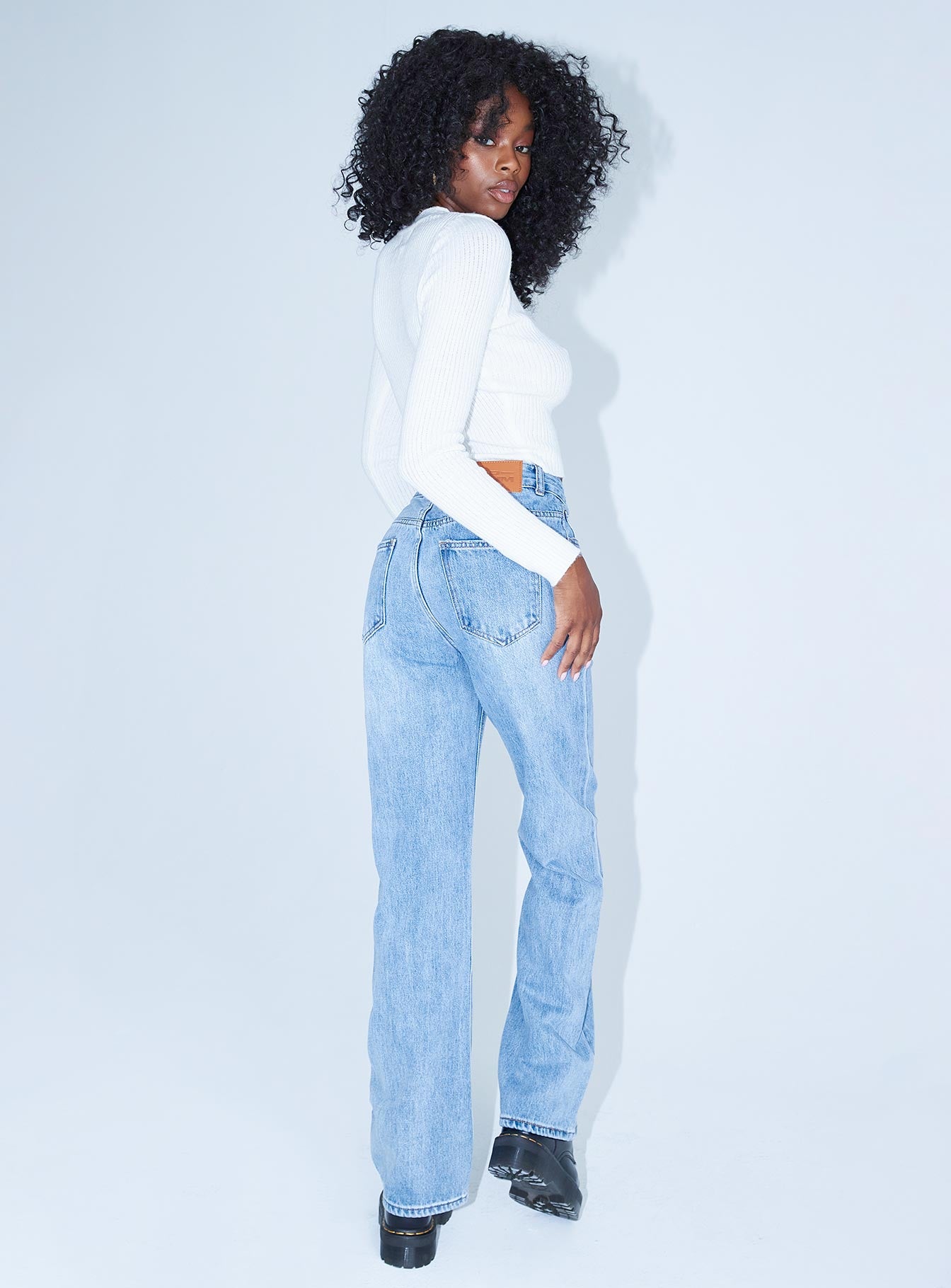 back view of model wearing Princess Polly New York City Denim Jeans Mid Rise 
