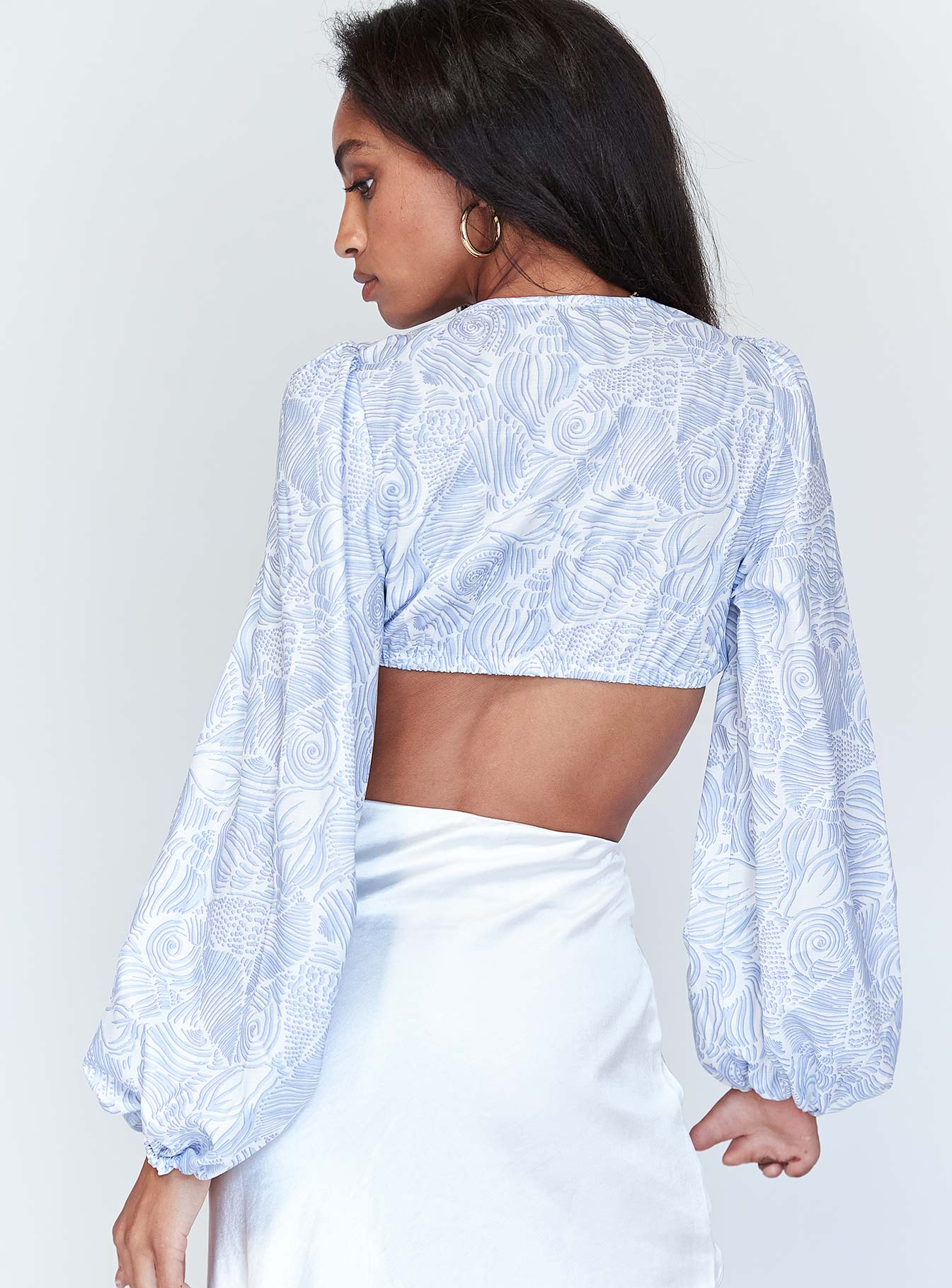 back view of model wearing Princess Polly Lyric Long Sleeve Crop Top Blue 