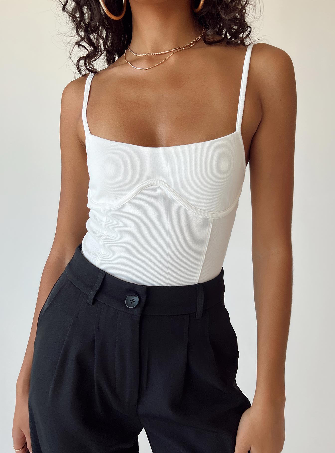 front view of model wearing Princess Polly Allred Bodysuit White Sleeveless Square Neck 