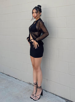 side view of model wearing Princess Polly Mariam Shirt Black Full Sleeves V-Neck 