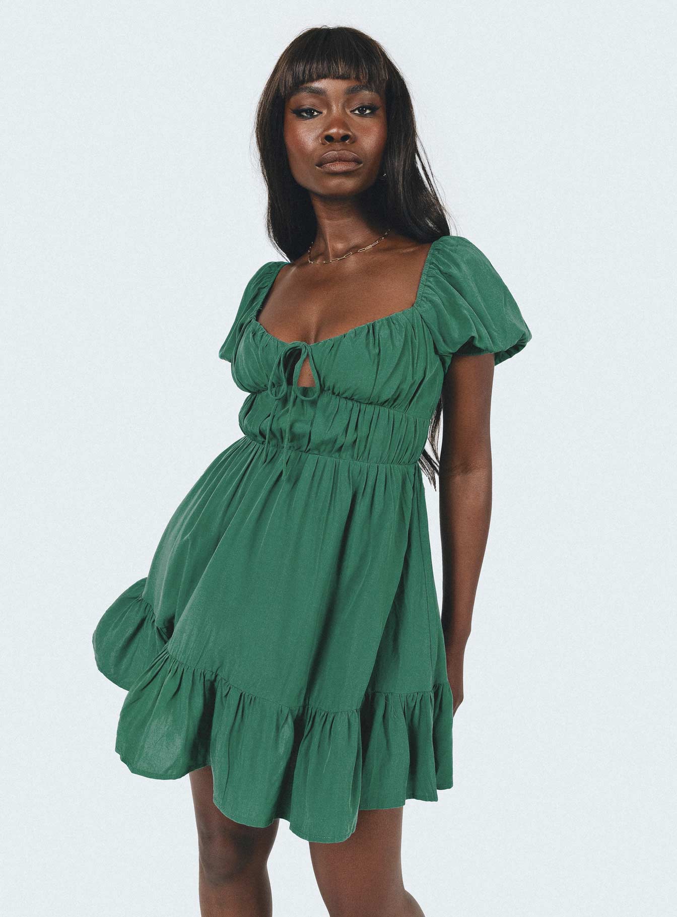 Front view of model wearing  front Princess Polly Asymmetric Neckline  Jacquie Mini Dress Green