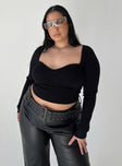 Front view of model wearing  front Princess Polly High Waisted Pants  Torridon Eyelet Belt Faux Leather Pants Black Curve