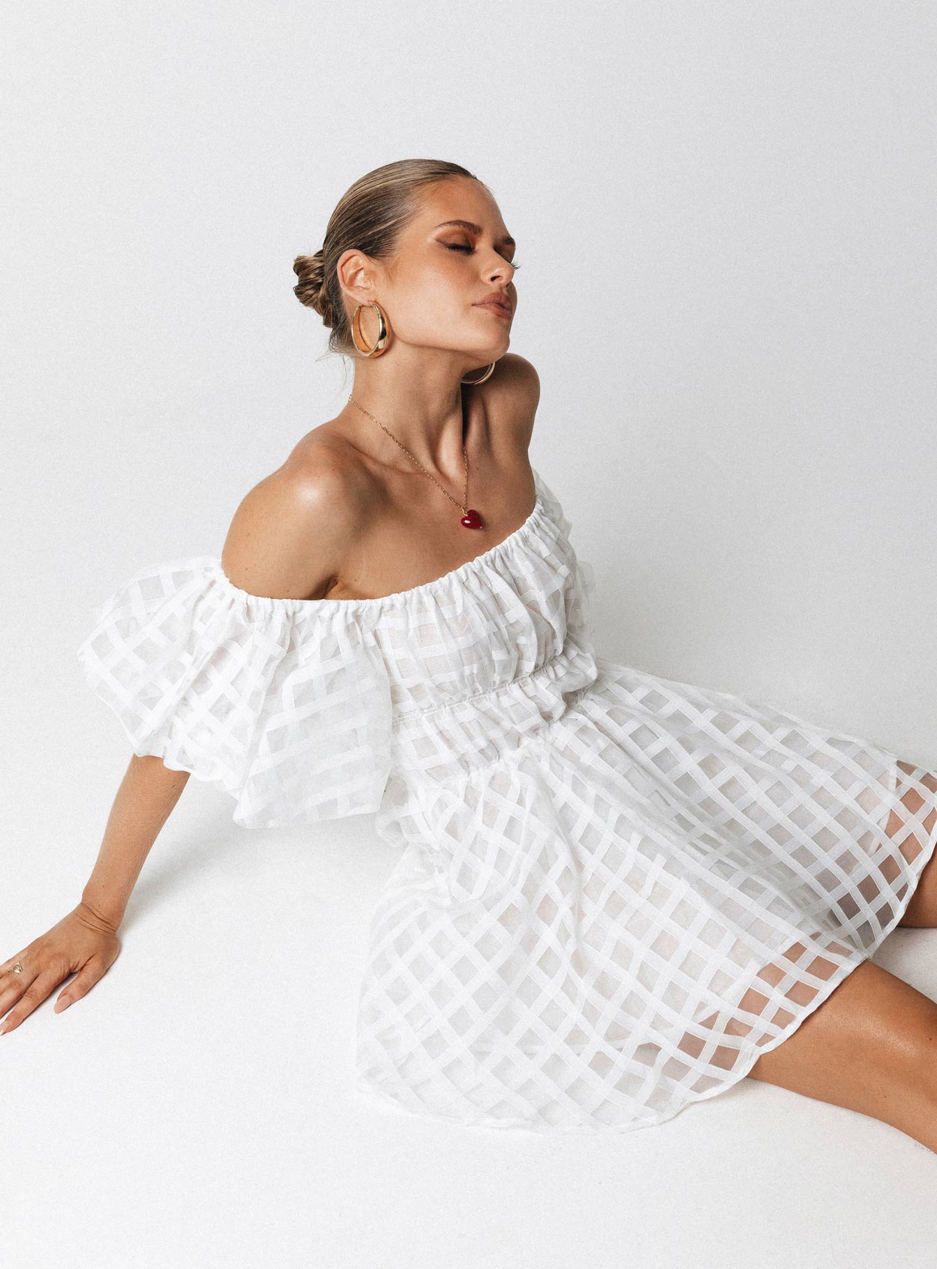 Front view of model wearing  front Princess Polly Asymmetric Neckline  Pascali Mini Dress White