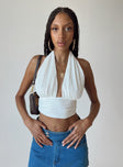 Front view of model wearing  front Princess Polly Sleeveless Square Neck  Cambor Halter Top Off White