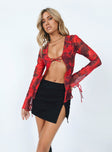 Red long sleeve top Sheer material  Printed design  Collared design Tie front fastening  Open front  Tie fastening at cuffs 