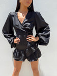 Front view of model wearing  front Princess Polly High Neck  Sharnaya Wrap Mini Dress Black