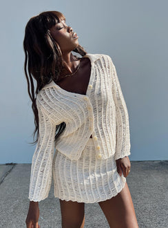 Matching set Knit material Long sleeve top V-neckline Classic collar Button fastening at front Mini skirt Elasticated band at waist Good stretch