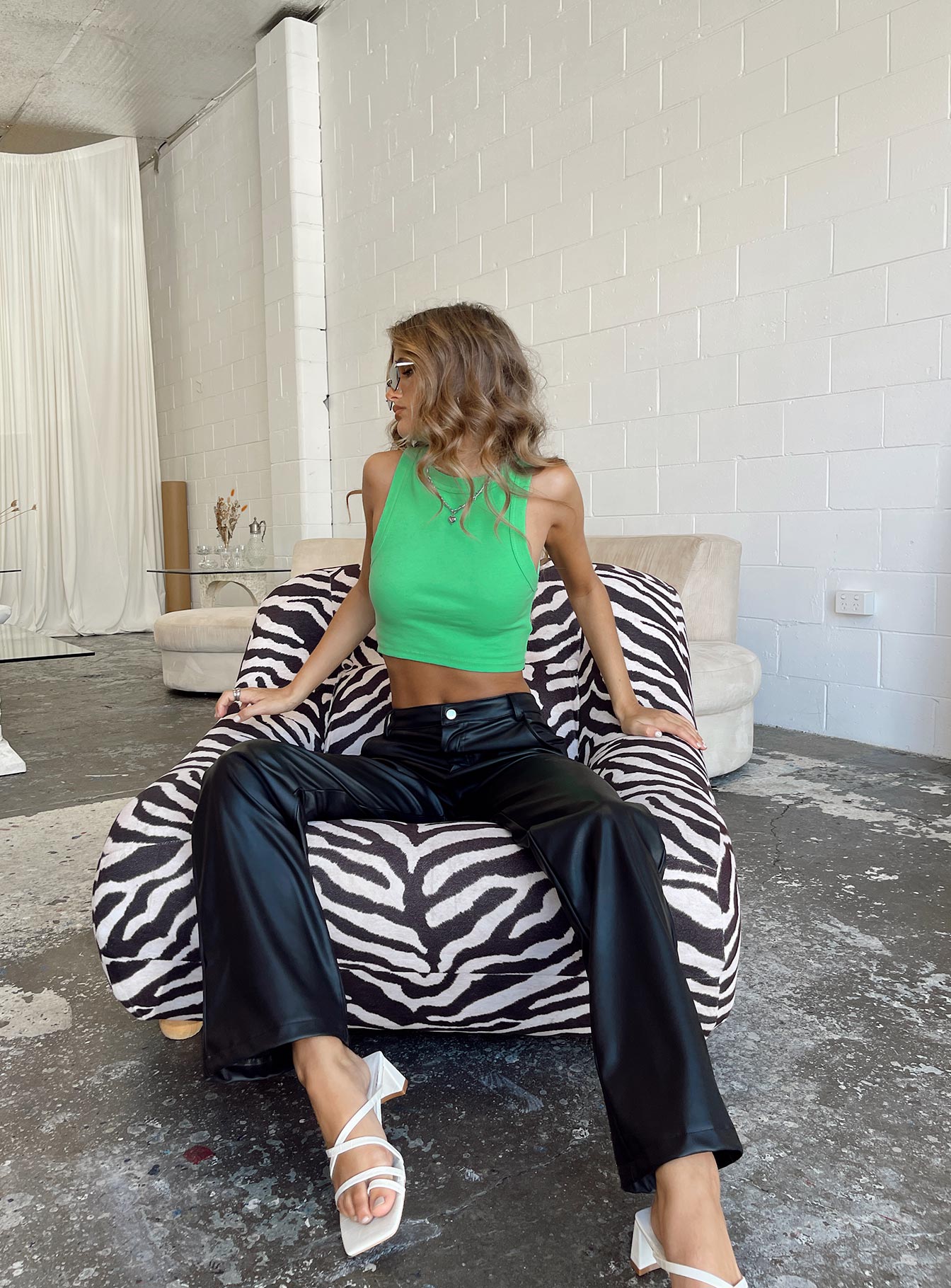 Front view of model wearing  front Princess Polly Full Sleeves High Neck  Classic Tank Top Green