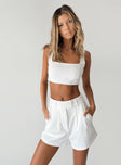 White matching set Crop top  Invisible zip fastening at side  High waisted shorts  Zip & button fastening  Belt looped waist  Twin hip pockets  Pleated design 
