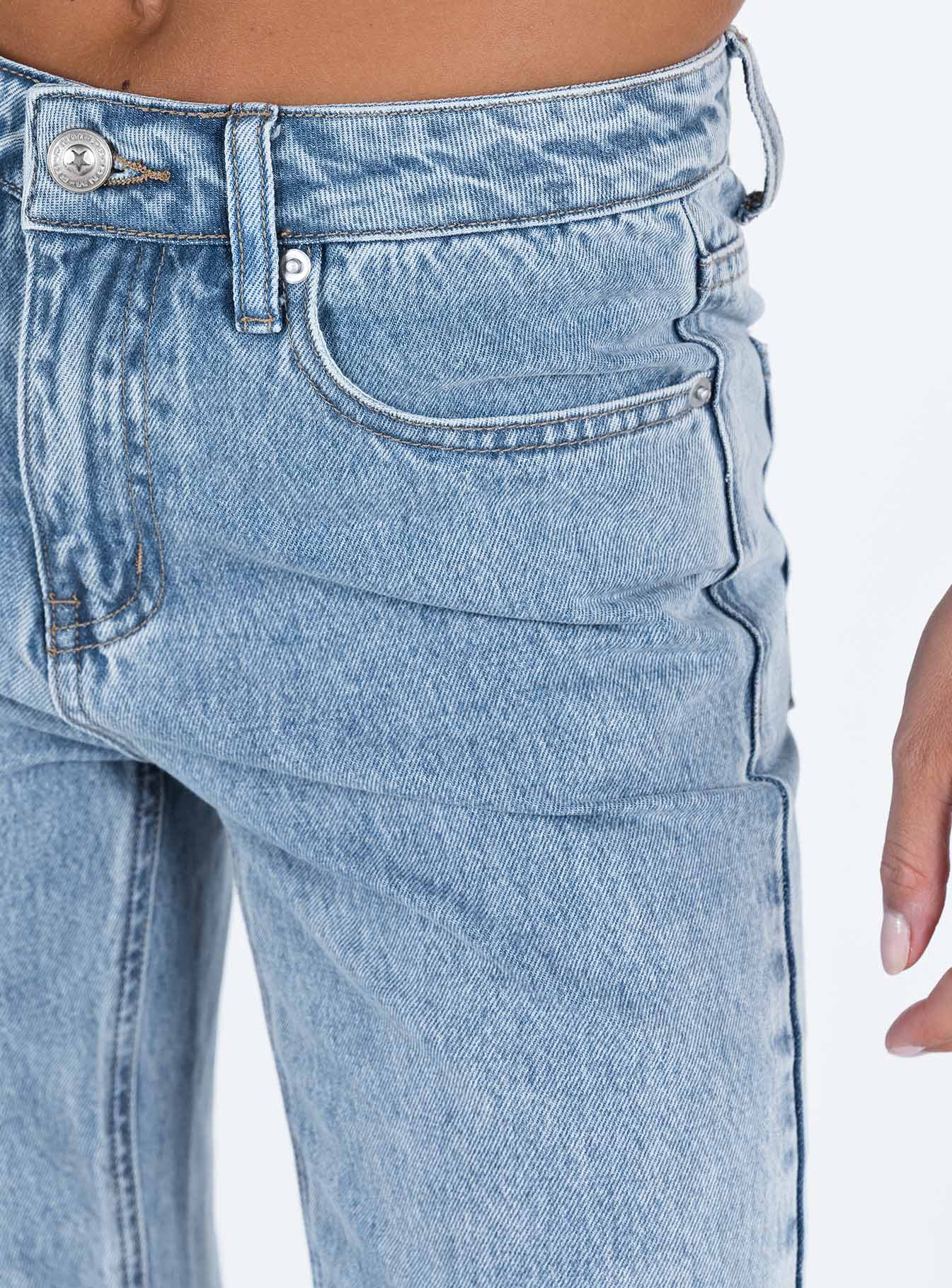 Front view of model wearing  front Princess Polly Mid Rise  Camilu Split Hem Jeans Denim