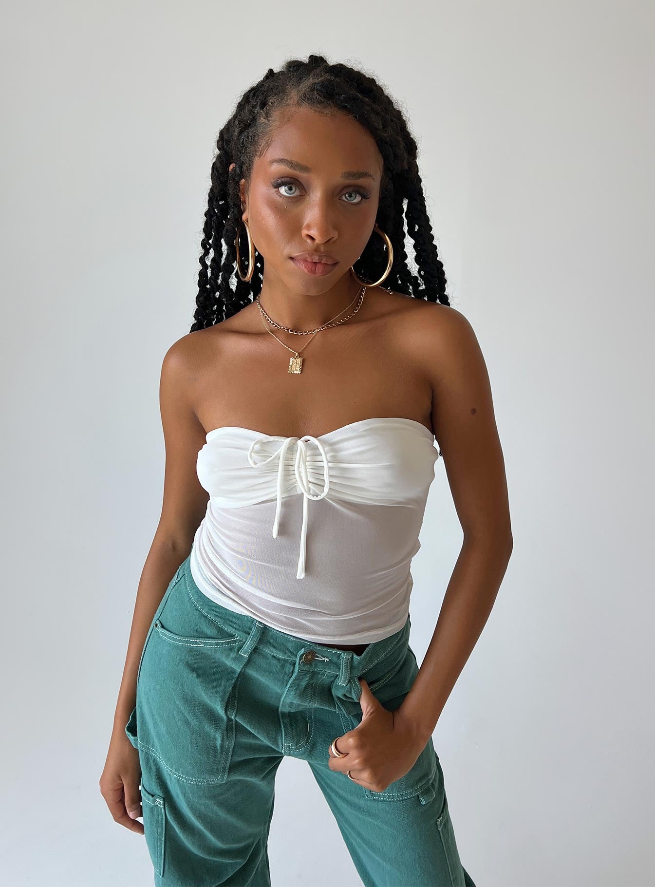 Front view of model wearing  front Princess Polly Sleeveless Sweetheart  Solana Strapless Longline Top White