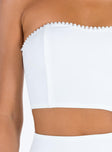 White two piece set Strapless crop top Pearl embellishments at bust Boning through bust Invisible zip fastening at back  Mini skirt Side split Invisible zip fastening at side