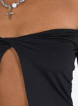 Black top Off the shoulder design Inner silicone strip at bust Split hem Good stretch Partially lined
