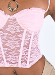 Pink crop top Mesh material Adjustable shoulder straps  Sweetheart neckline Ruched design at bust Wired cups Boning throughout Zip fastening at back Good stretch Lined bust
