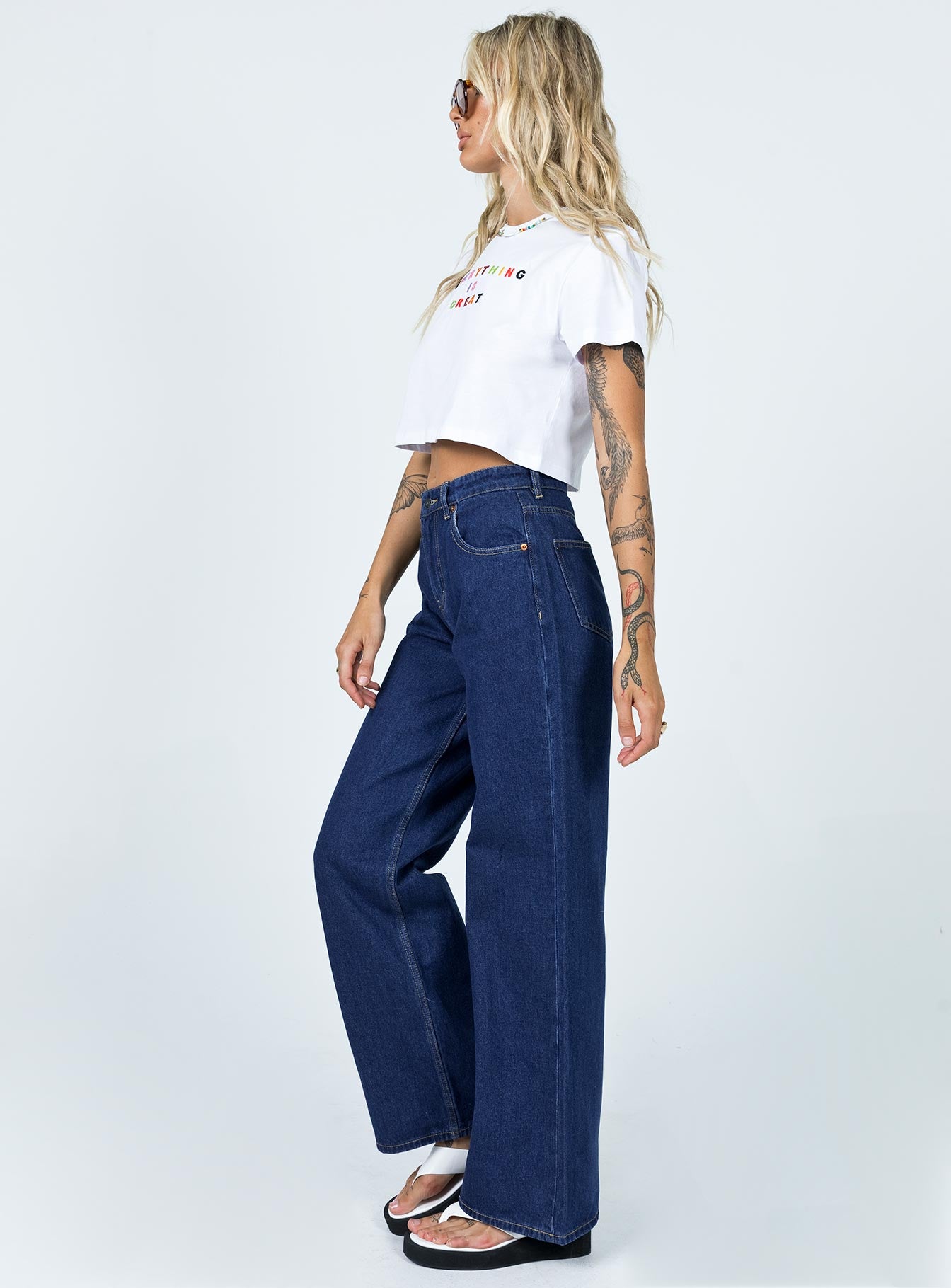 side view of model wearing Princess Polly Motel Extra Wide Jeans Indigo Blue Mid Rise 