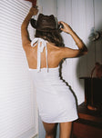 back view of model wearing Princess Polly Positano Mini Dress White Plunger 