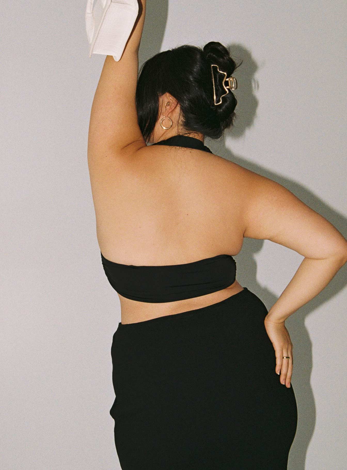 back view of model wearing Princess Polly Jordy Top Black Curve Eco Sleeveless Plunger 