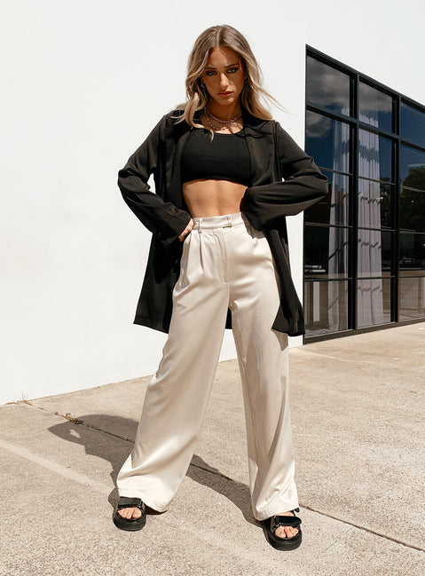 Front view of model wearing  front Princess Polly High Waisted Pants  Amalia Pants Beige