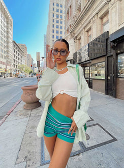 Front view of model wearing  front Princess Polly Short Sleeves High Neck  Angeline Top Green