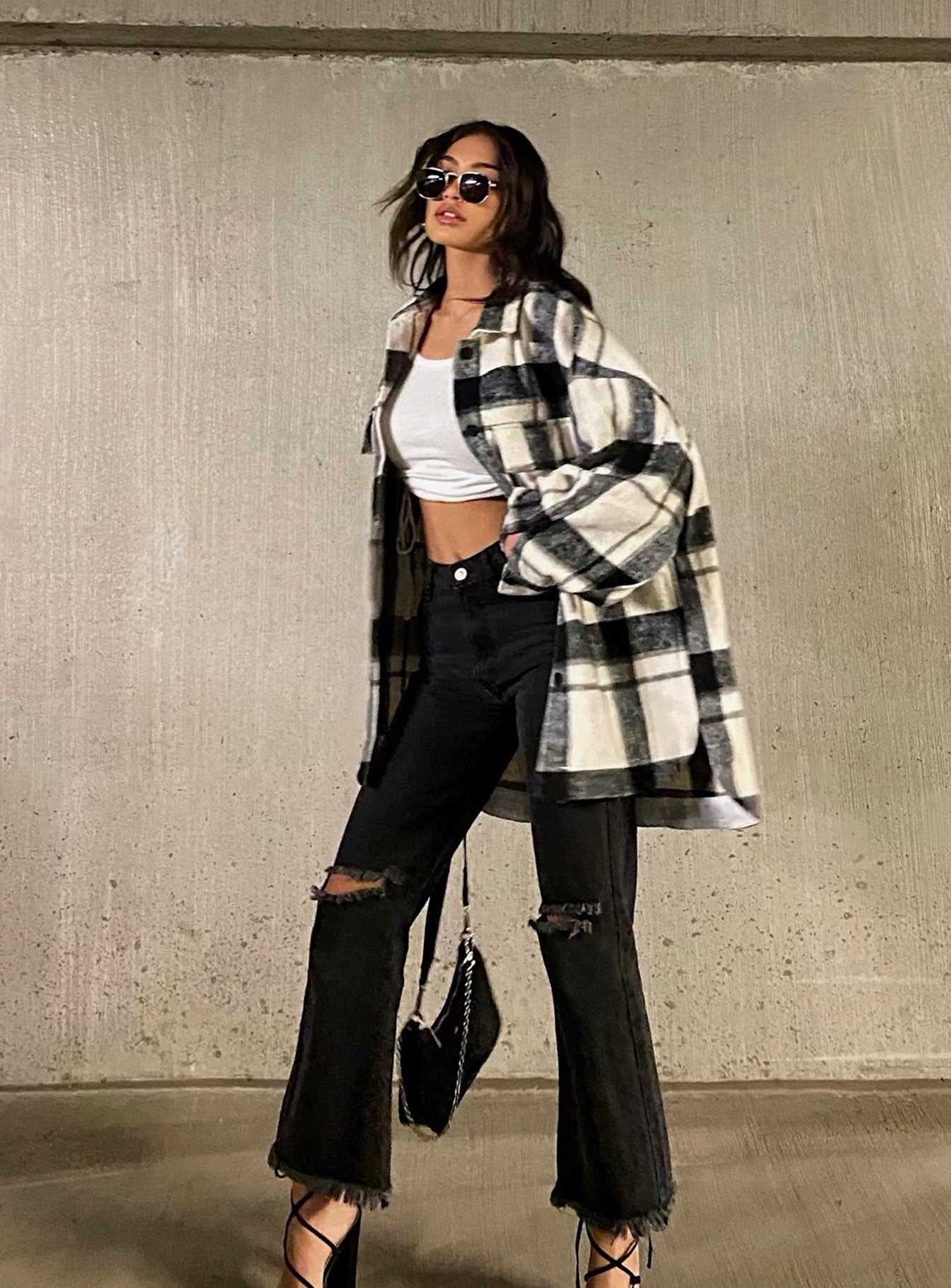 back view of model wearing Princess Polly Cece Hammer Wide Leg Knee Rip Jeans Black Denim High Waisted 