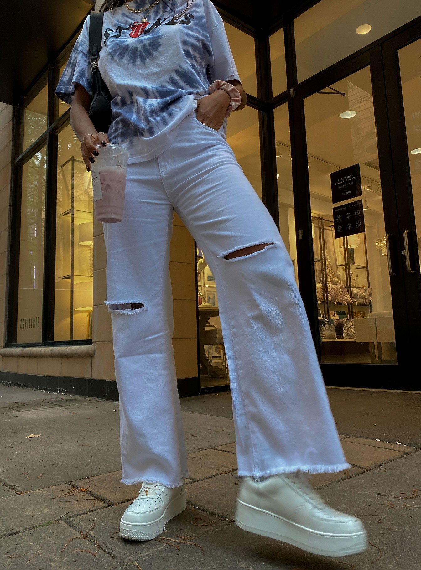 front view of model wearing Princess Polly Cece Hammer Wide Leg Knee Rip Jeans White Denim Mid Rise 
