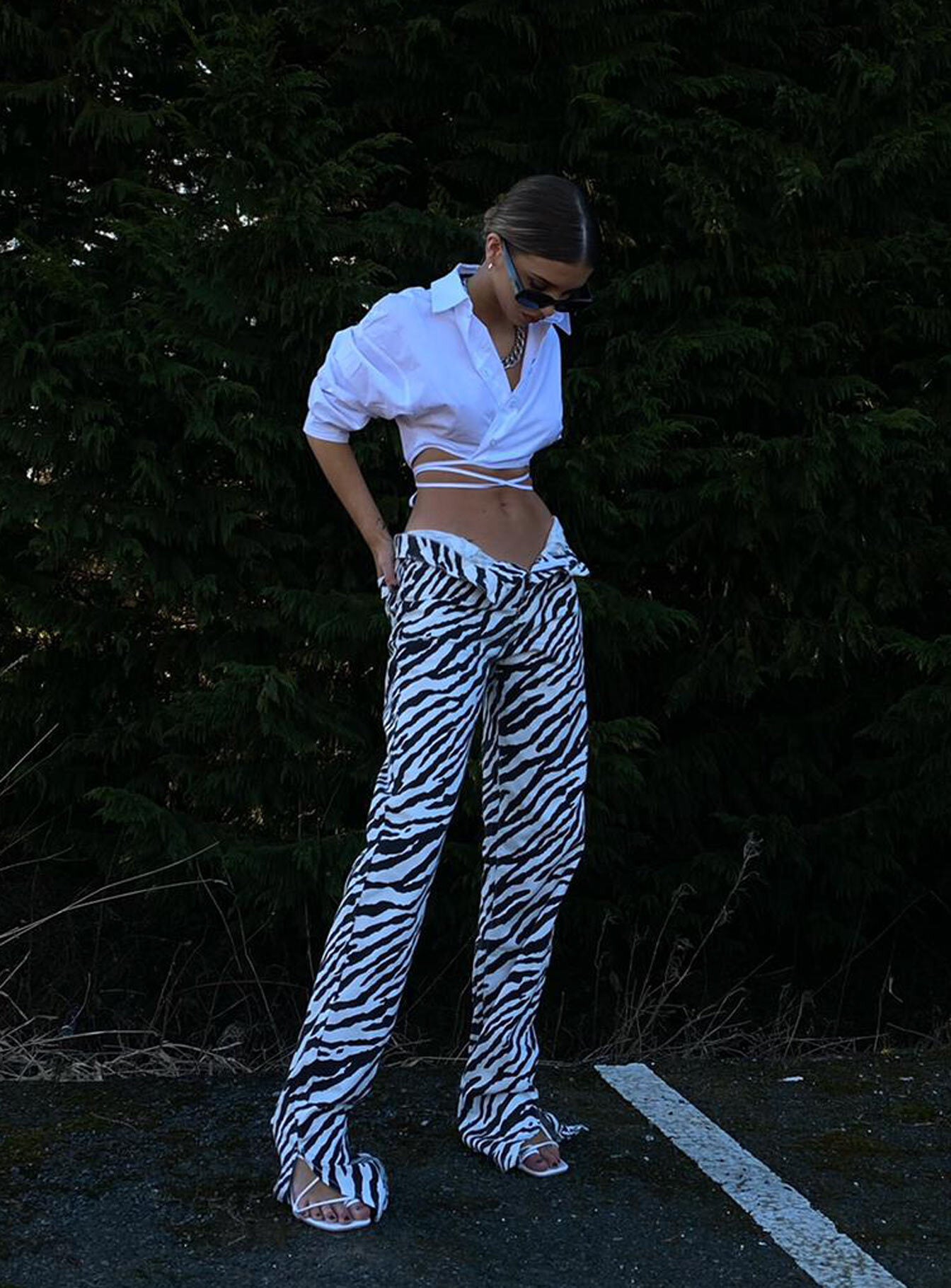 side view of model wearing Princess Polly Alabama Jeans Zebra Mid Rise 