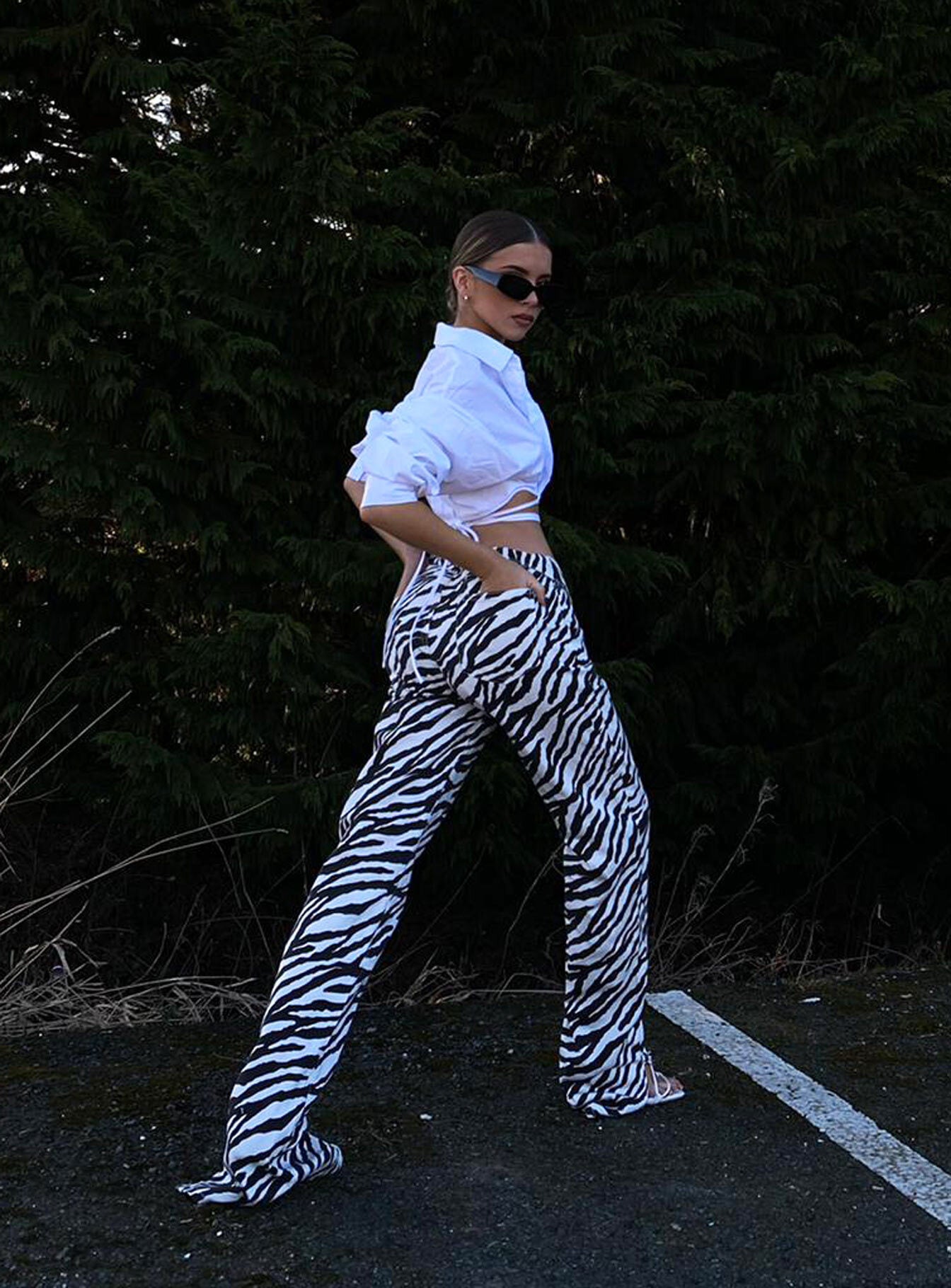side view of model wearing Princess Polly Alabama Jeans Zebra Mid Rise 