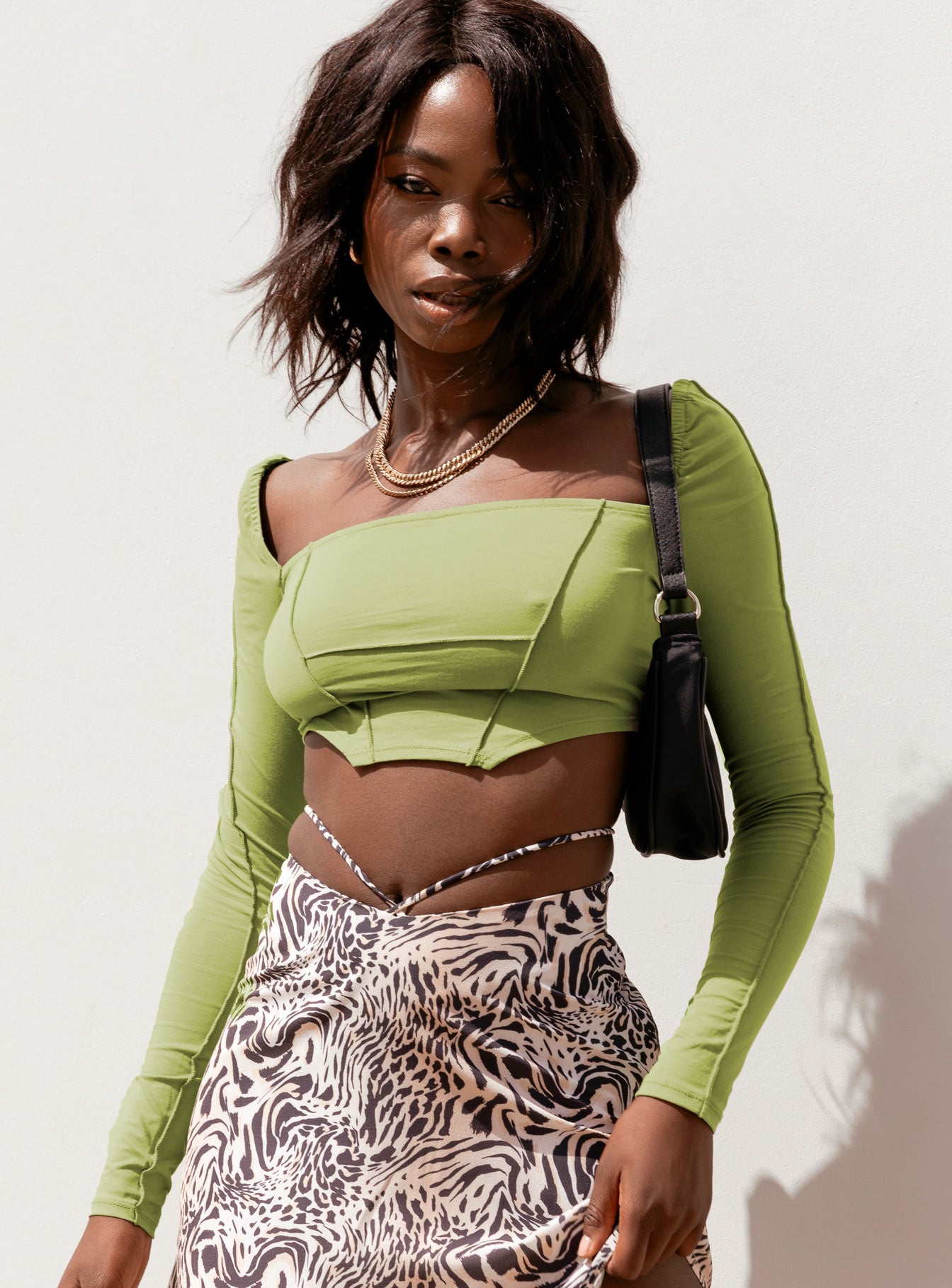 front view of model wearing Princess Polly Blakely Long Sleeve Top Green 