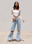 front view of model wearing Princess Polly Maple Flare Jeans Knee Rips Light Wash Denim Mid Rise 