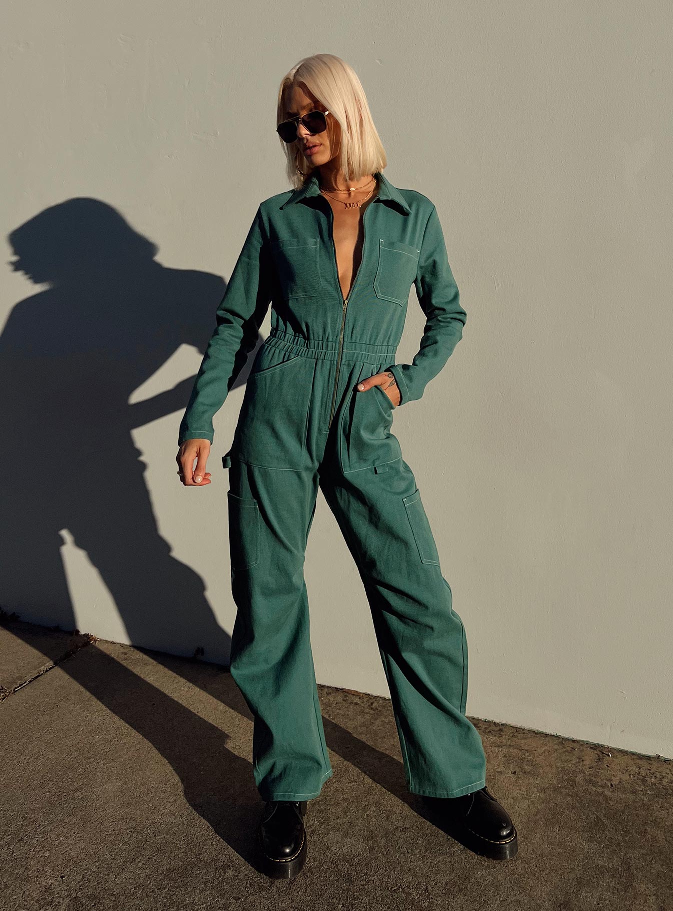 Boiler suit 100% cotton Relaxed fit Contrast stitching  Classic collar  Zip front fastening  Twin chest pockets  Six leg pockets  Elasticated waistband   Wide leg  Pleated detail at inner leg 