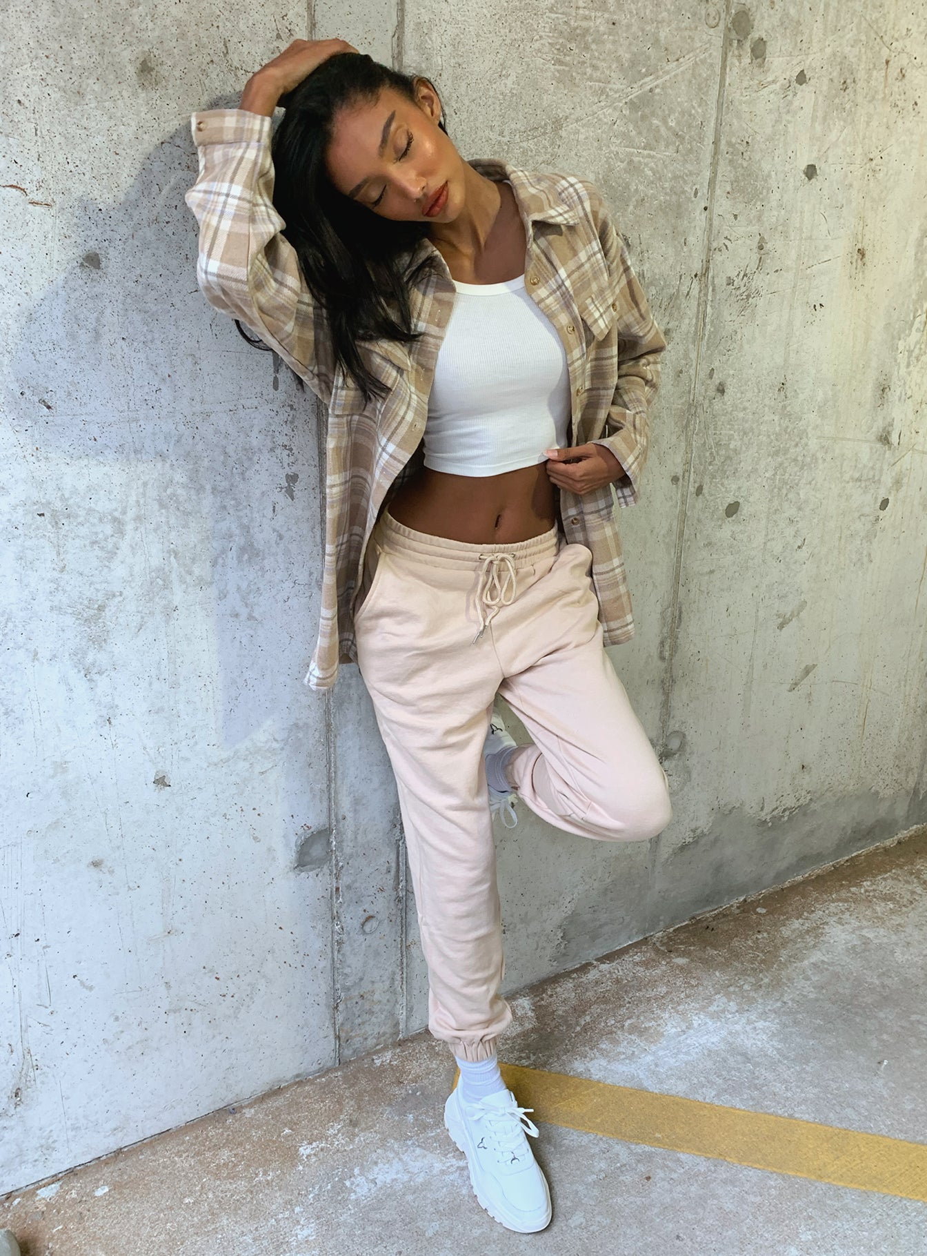 back view of model wearing Princess Polly Nero Sweat Pants Beige 