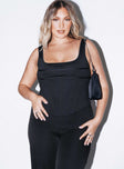 front view of model wearing Princess Polly Normani Top Black Sleeveless Square Neck 