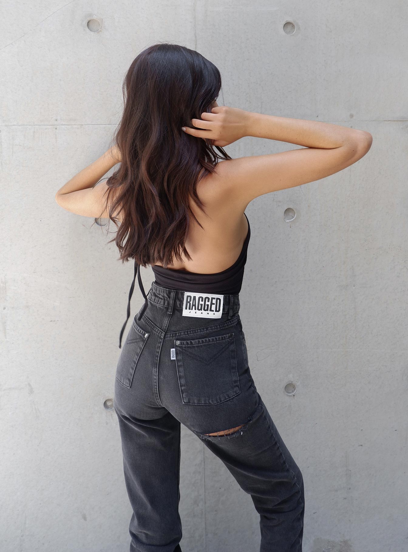 back view of model wearing Princess Polly Ragged Priest Butt Cut Jean Mid Rise 